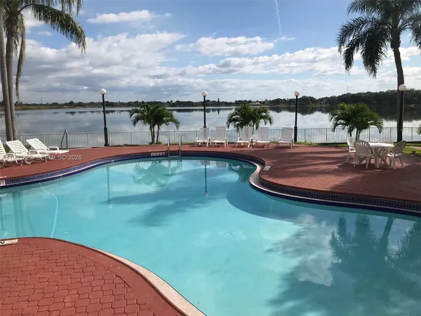 a view of a swimming pool with a lake view