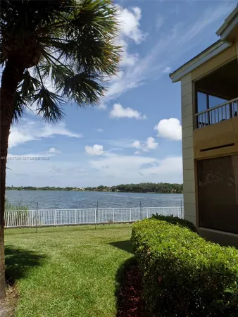 a view of a lake with a big yard