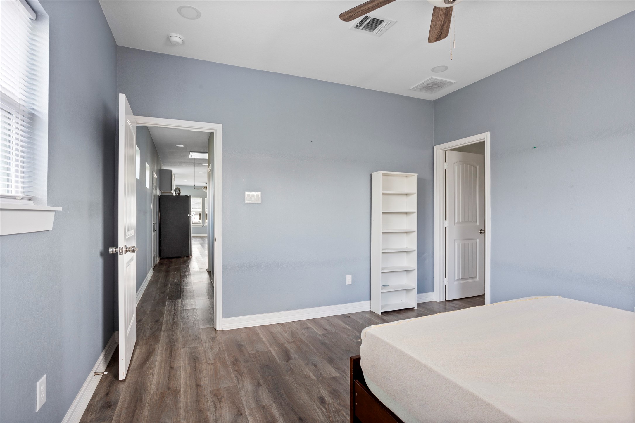9814 Masterson Street Houston, TX 77029 - Photo 11 of 21 a bedroom with a bed and a dresser