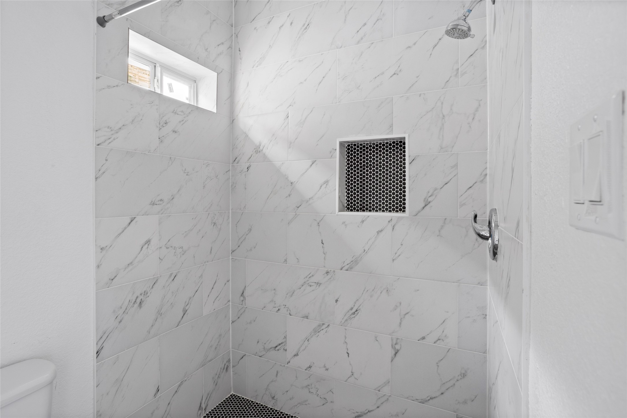 9814 Masterson Street Houston, TX 77029 - Photo 14 of 21 a bathroom with a shower