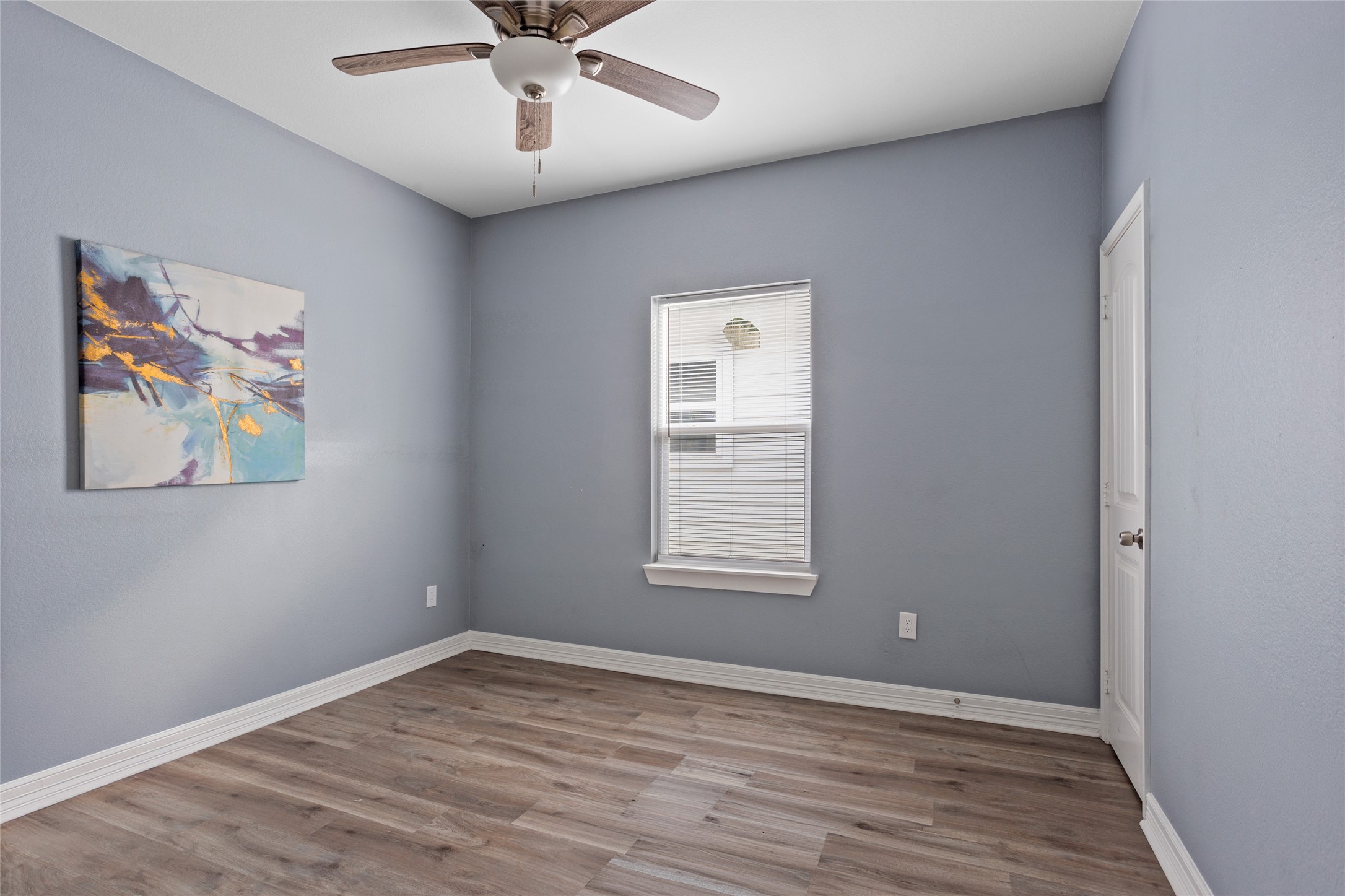 9814 Masterson Street Houston, TX 77029 - Photo 16 of 21 wooden floor in an empty room with a window