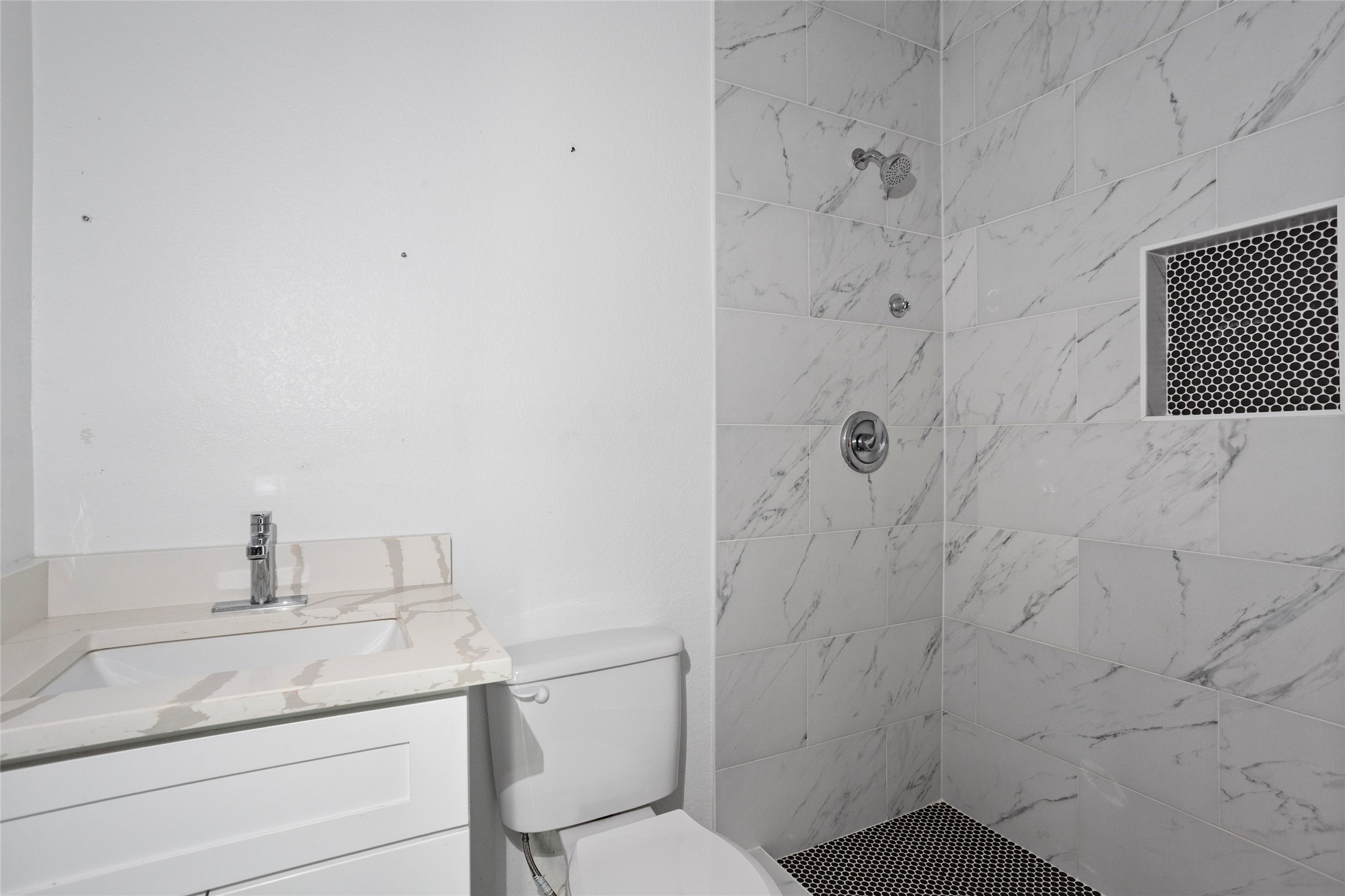9814 Masterson Street Houston, TX 77029 - Photo 17 of 21 a bathroom with a granite countertop sink toilet and shower