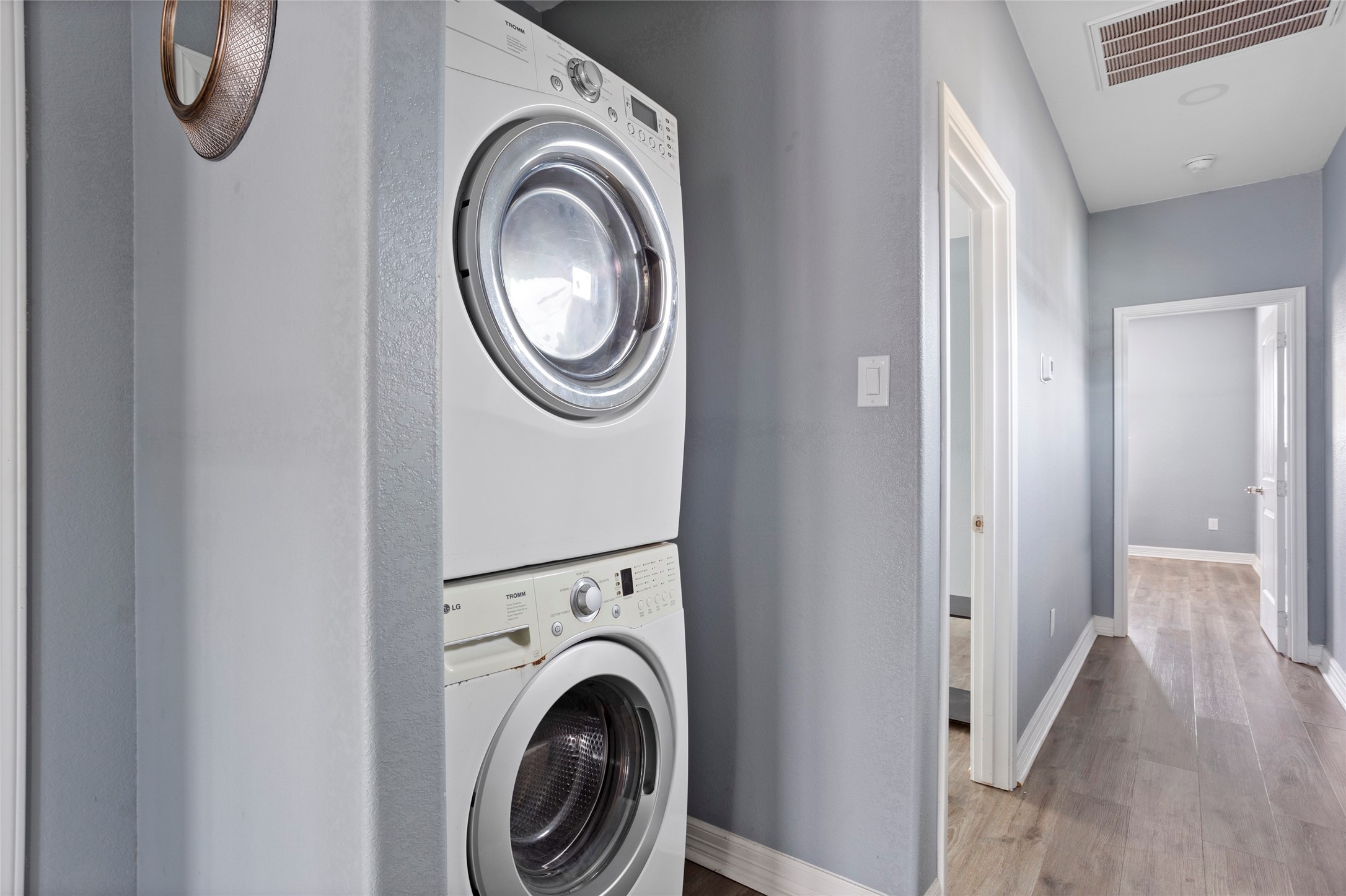 9814 Masterson Street Houston, TX 77029 - Photo 18 of 21 a view of a hallway with washer and dryer