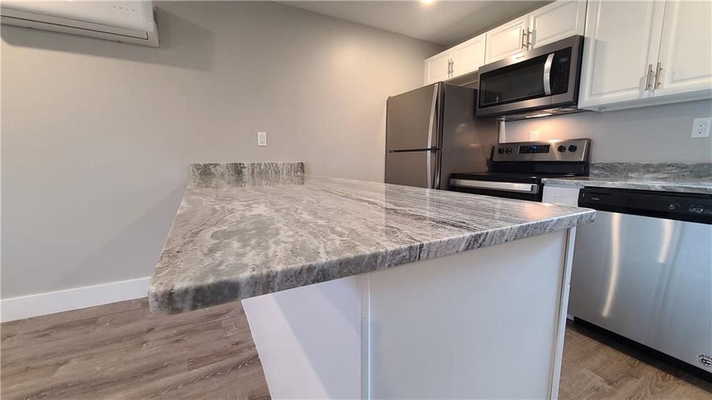 1331 Freeport Road Cheswick, PA 15024 - Photo 2 of 32 a kitchen with granite countertop a sink and stainless steel appliances