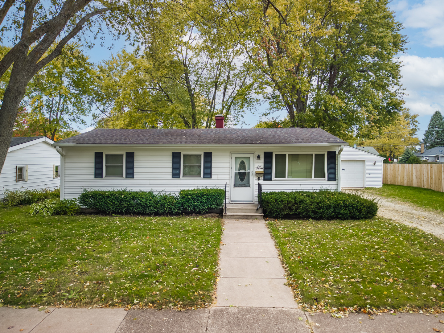 a front view of a house with yard