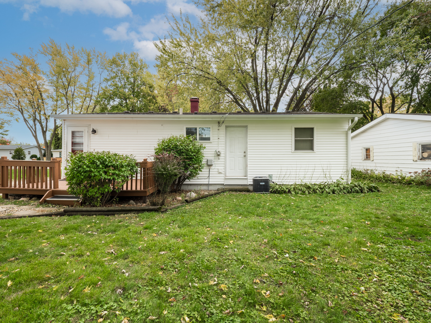 615 Best Avenue DeKalb, IL 60115 - Photo 6 of 12 a view of a house with a yard and plants