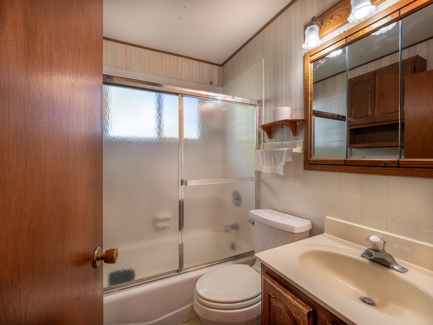 615 Best Avenue DeKalb, IL 60115 - Photo 10 of 12 a bathroom with a sink toilet and shower