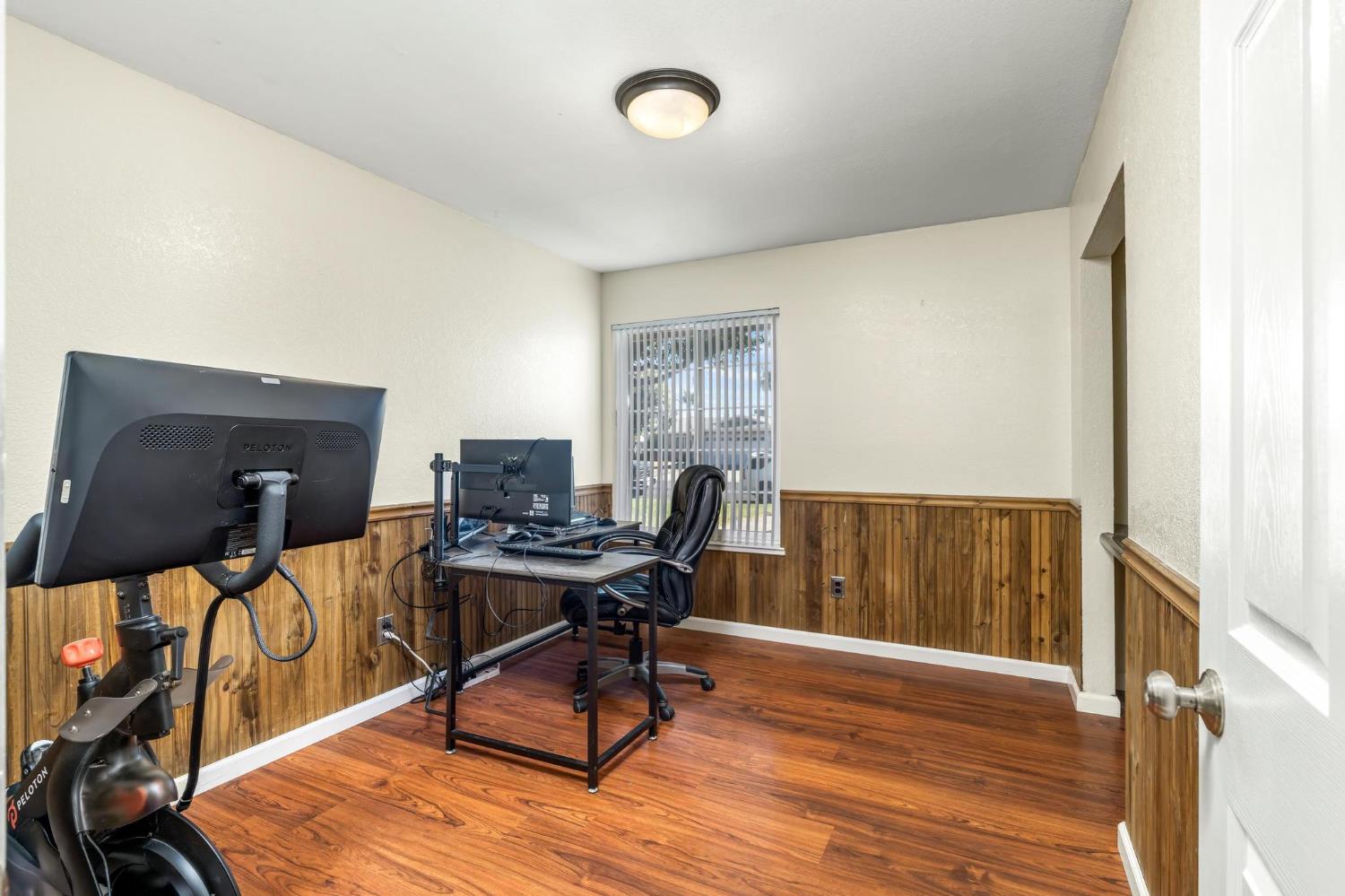 731 Dixie Lane Ripon, CA 95366 - Photo 11 of 22 a workspace with furniture window and wooden floor