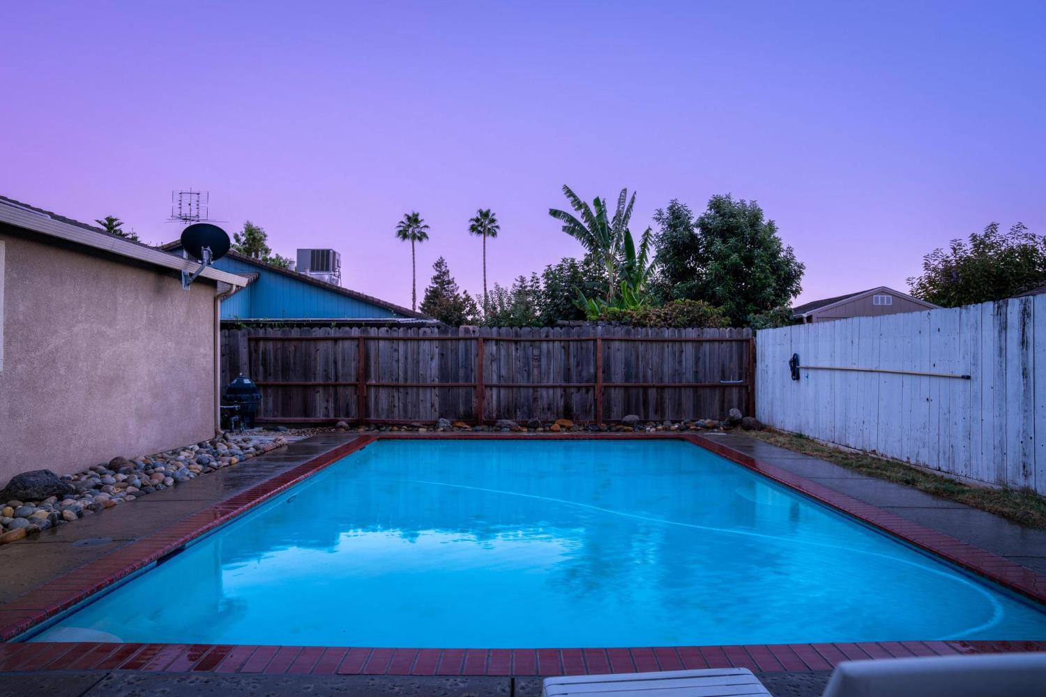 731 Dixie Lane Ripon, CA 95366 - Photo 19 of 22 a view of a backyard with wooden fence