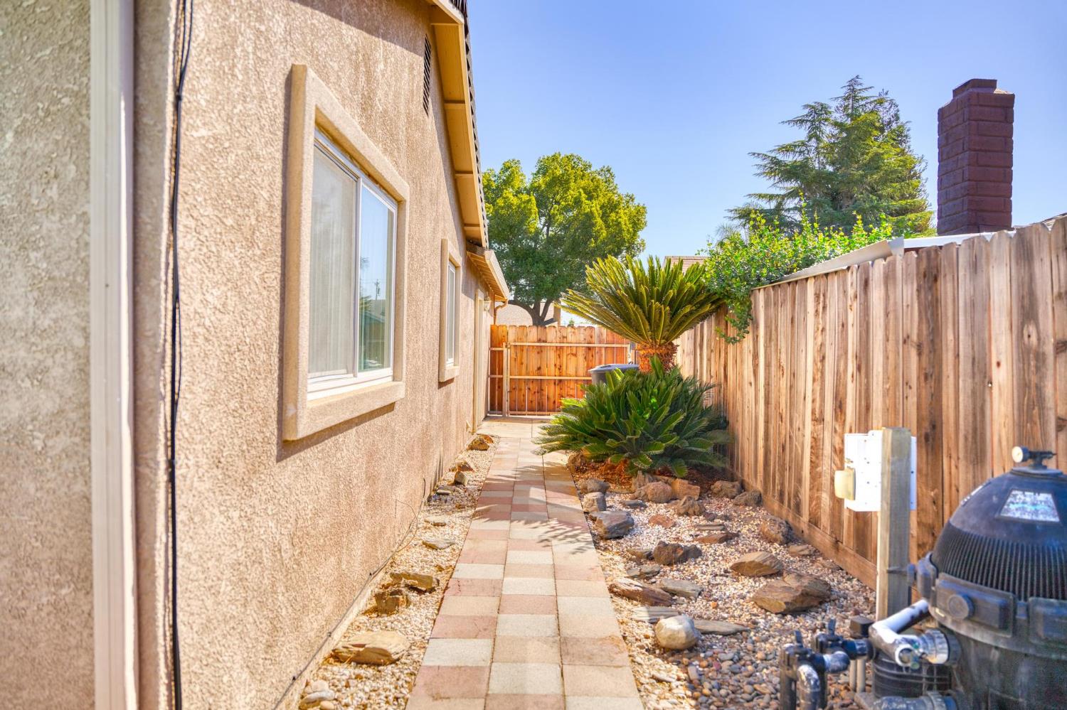 731 Dixie Lane Ripon, CA 95366 - Photo 20 of 22 a couple of potted plants in front of door