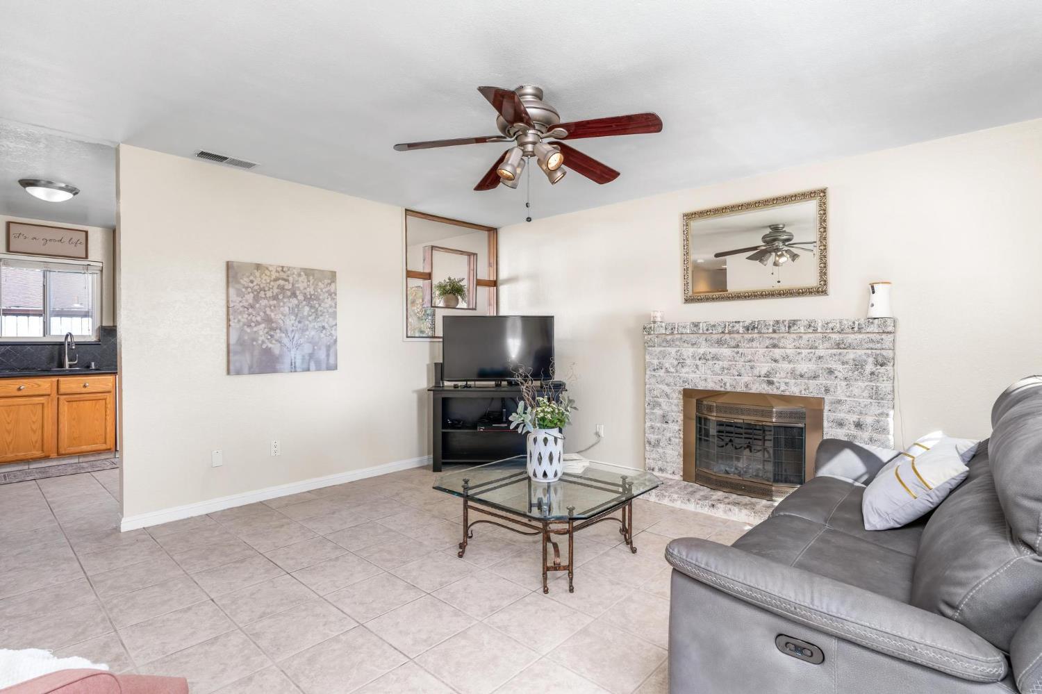731 Dixie Lane Ripon, CA 95366 - Photo 4 of 22 a living room with furniture and a fireplace