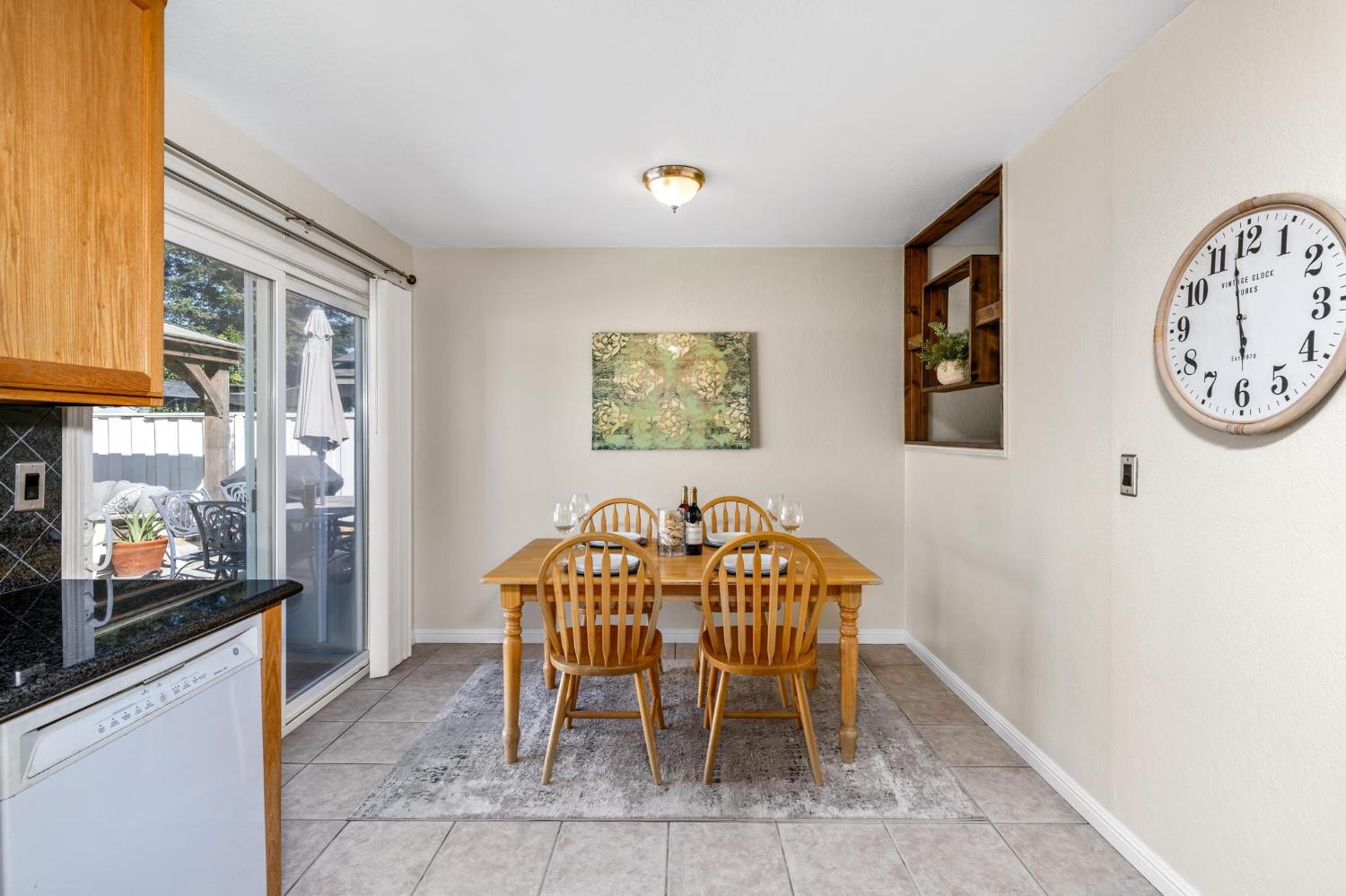 731 Dixie Lane Ripon, CA 95366 - Photo 7 of 22 a view of a dining room with furniture and a kitchen