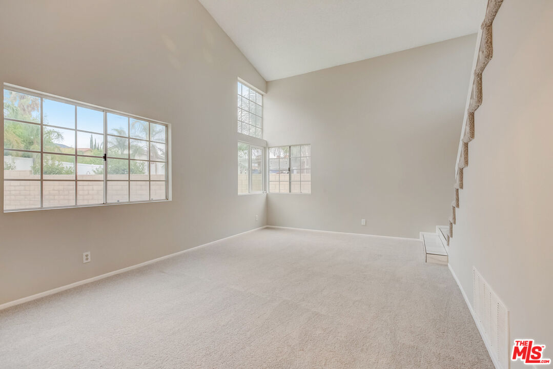 11038 Malone Street Rancho Cucamonga, CA 91701 - Photo 13 of 31 an empty room with windows