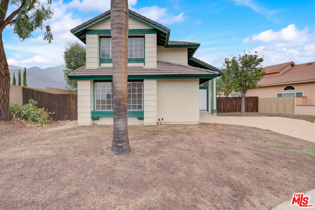 11038 Malone Street Rancho Cucamonga, CA 91701 - Photo 10 of 31 a front view of a house with a yard