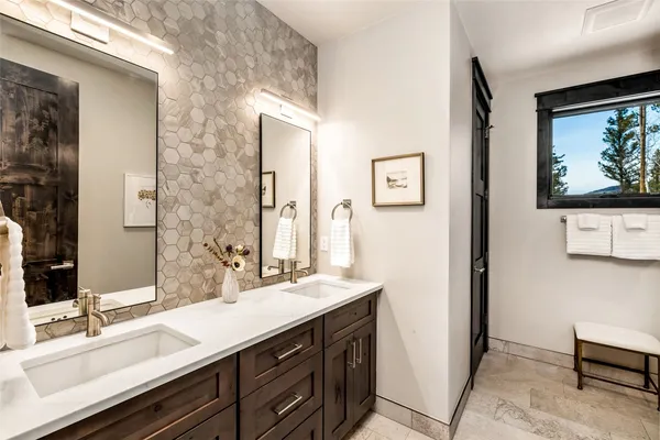 a bathroom with a sink a vanity and a mirror