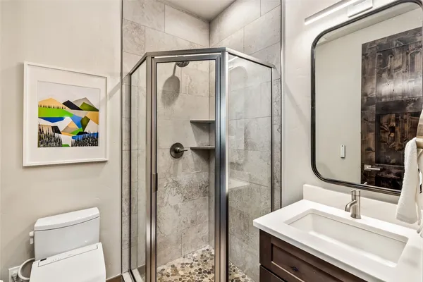 a bathroom with a sink vanity and a mirror