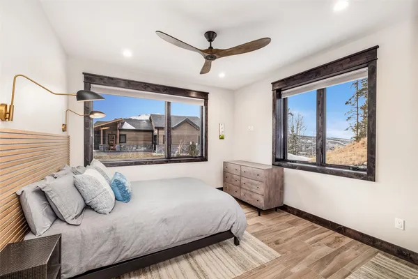 a bedroom with furniture and a window