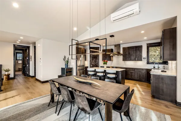 a view of a dining room with furniture and wooden floor
