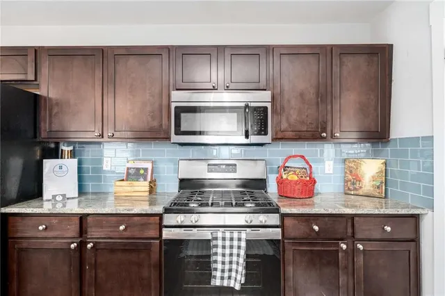 a view of a hallway with washer and dryer