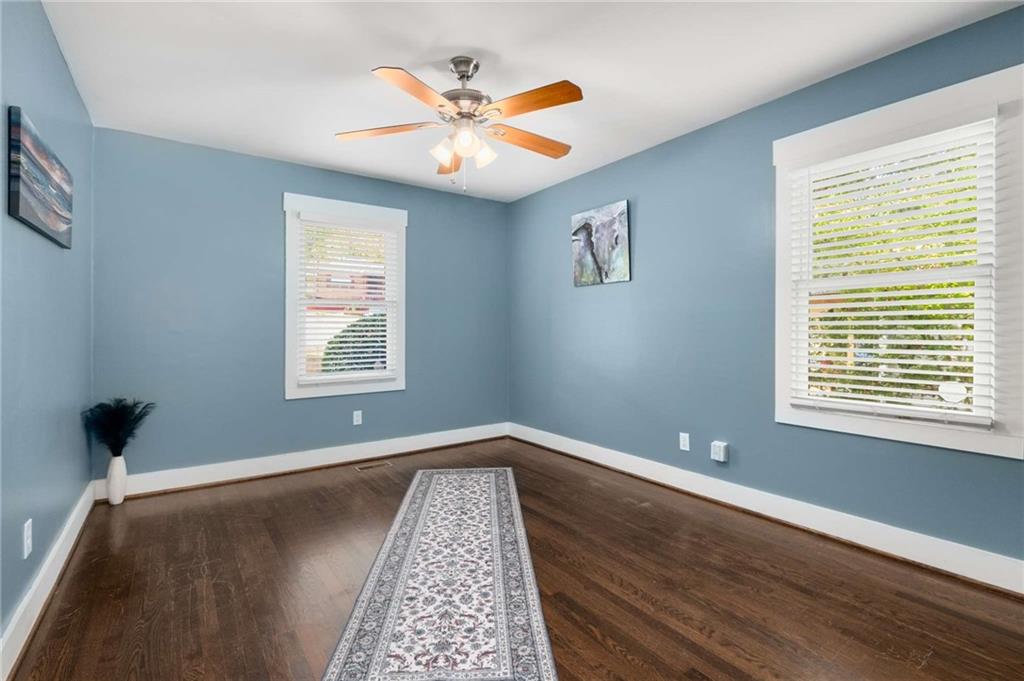 2046 Settle Circle Southeast Atlanta, GA 30316 - Photo 18 of 36 a view of an empty room with window and wooden floor