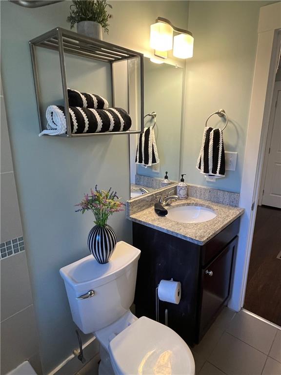 2046 Settle Circle Southeast Atlanta, GA 30316 - Photo 21 of 36 a bathroom with a granite countertop toilet sink and mirror