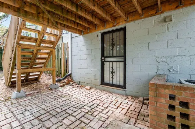 a view of chair and tables in the back yard