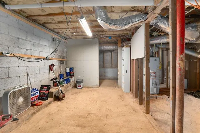 a small house in the middle of a yard