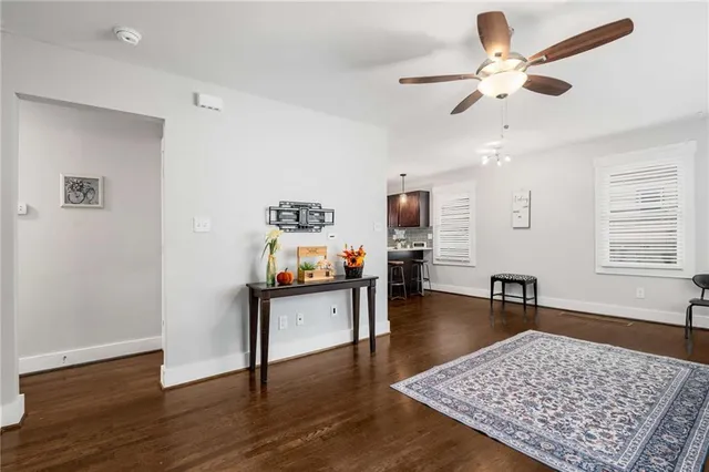 a living room with furniture rug and window