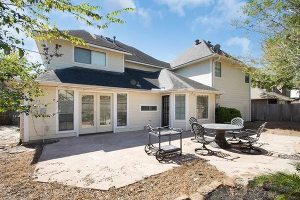 a view of a house with outdoor seating area