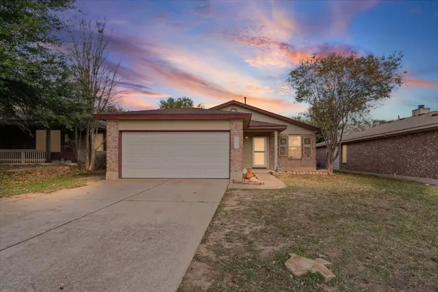 front view of a house with a dry yard