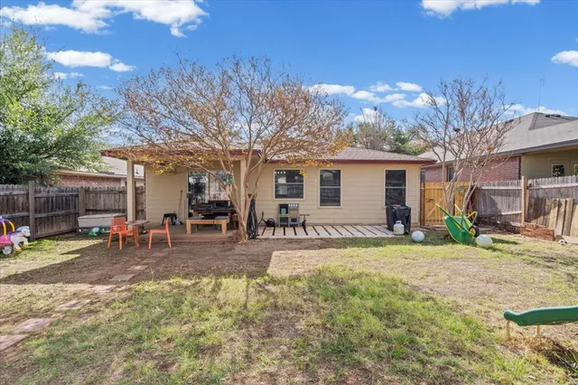 a view of a backyard with a patio