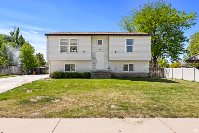 2327 880 North Provo, UT 84601 - Photo 1 of 15 Split-level residence featuring light-colored siding and a contrasting roofline