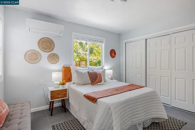 a bedroom with bed and window