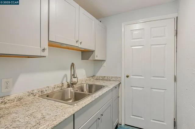 a white toilet sitting next to a bathroom sink