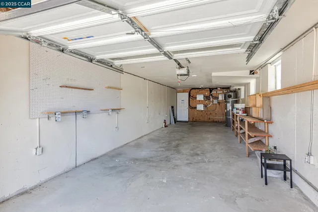a view of a balcony with chairs and potted plants