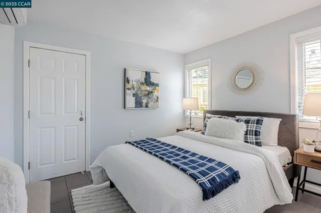 a bedroom with a large bed and a window