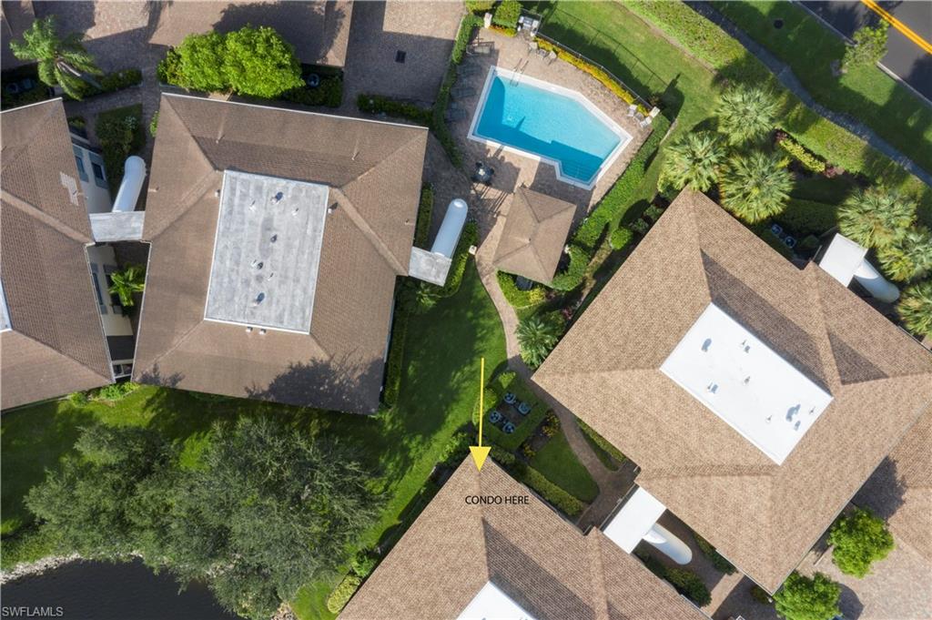 3107 Riviera Drive, Unit A202 Naples, FL 34103 - Photo 23 of 25 an aerial view of a house with garden