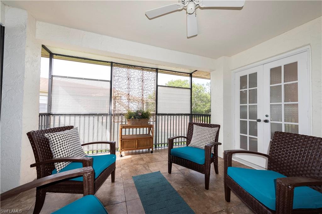 3107 Riviera Drive, Unit A202 Naples, FL 34103 - Photo 6 of 25 a living room with furniture and a window