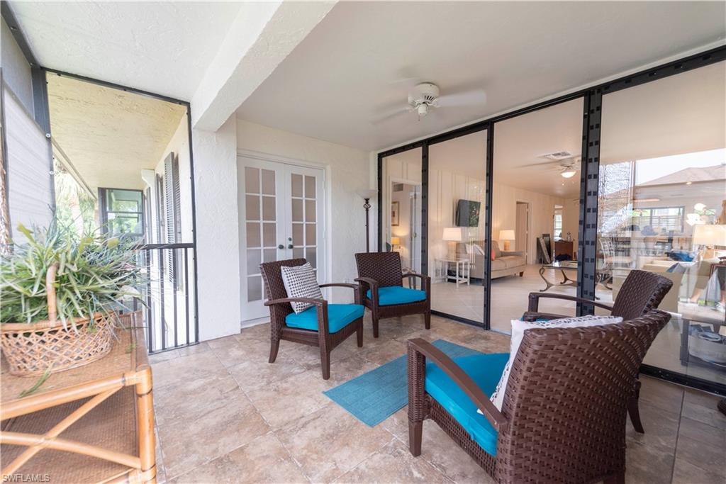 3107 Riviera Drive, Unit A202 Naples, FL 34103 - Photo 7 of 25 a living room with furniture and a large window