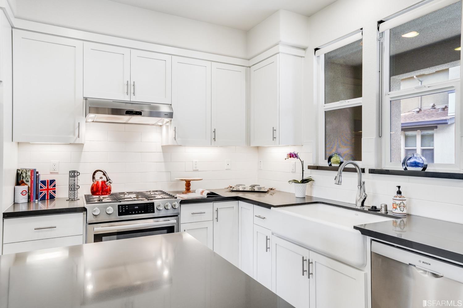 471 Mitchell Avenue Alameda, CA 94501 - Photo 11 of 50 a kitchen with white cabinets and sink