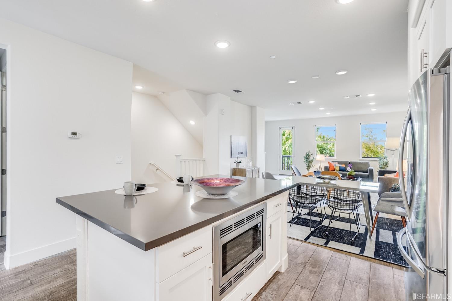 471 Mitchell Avenue Alameda, CA 94501 - Photo 12 of 50 a kitchen with stainless steel appliances a stove a sink and a refrigerator