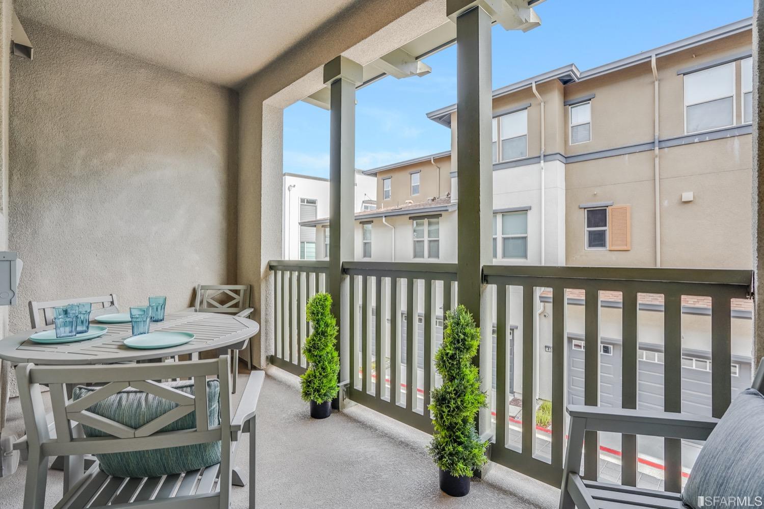 471 Mitchell Avenue Alameda, CA 94501 - Photo 15 of 50 a balcony with table and chairs