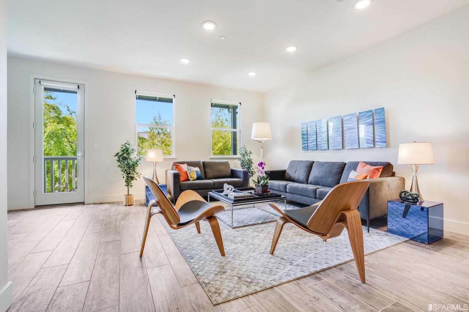 471 Mitchell Avenue Alameda, CA 94501 - Photo 20 of 50 a living room with furniture and a wooden floor