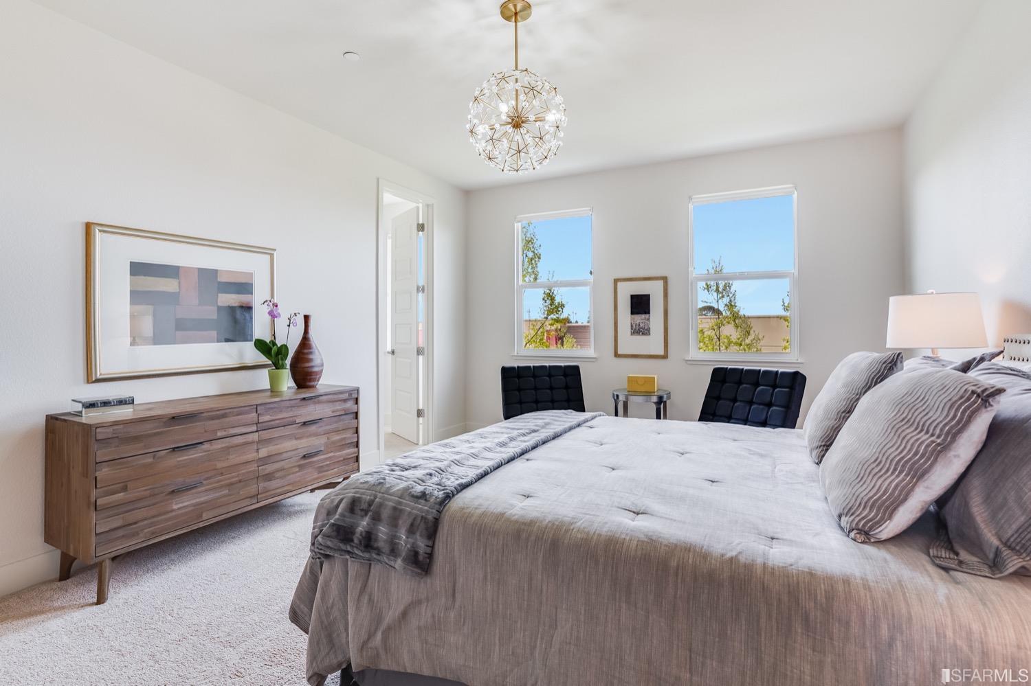 471 Mitchell Avenue Alameda, CA 94501 - Photo 28 of 50 a bedroom with a bed and a chandelier