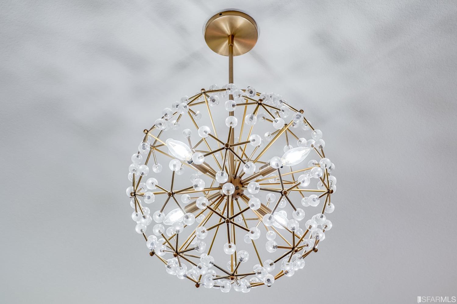 471 Mitchell Avenue Alameda, CA 94501 - Photo 29 of 50 a vase with flowers on a table and a chandelier