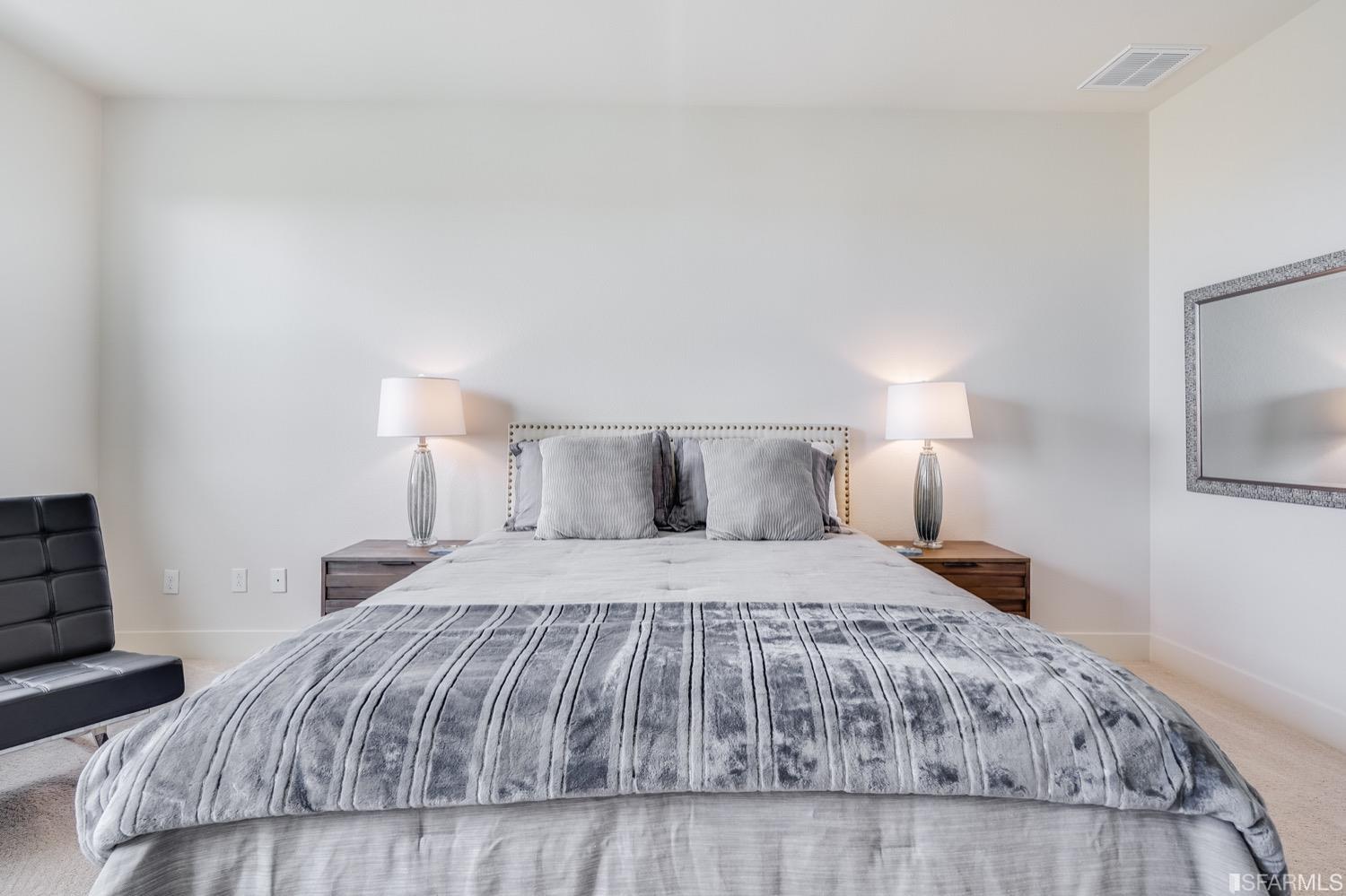 471 Mitchell Avenue Alameda, CA 94501 - Photo 30 of 50 a bedroom with a bed and wooden floor