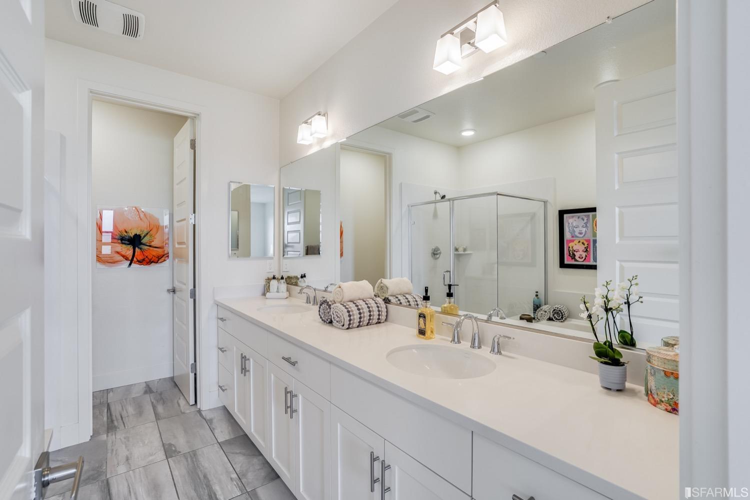471 Mitchell Avenue Alameda, CA 94501 - Photo 33 of 50 a bathroom with a double vanity sink mirror and shower
