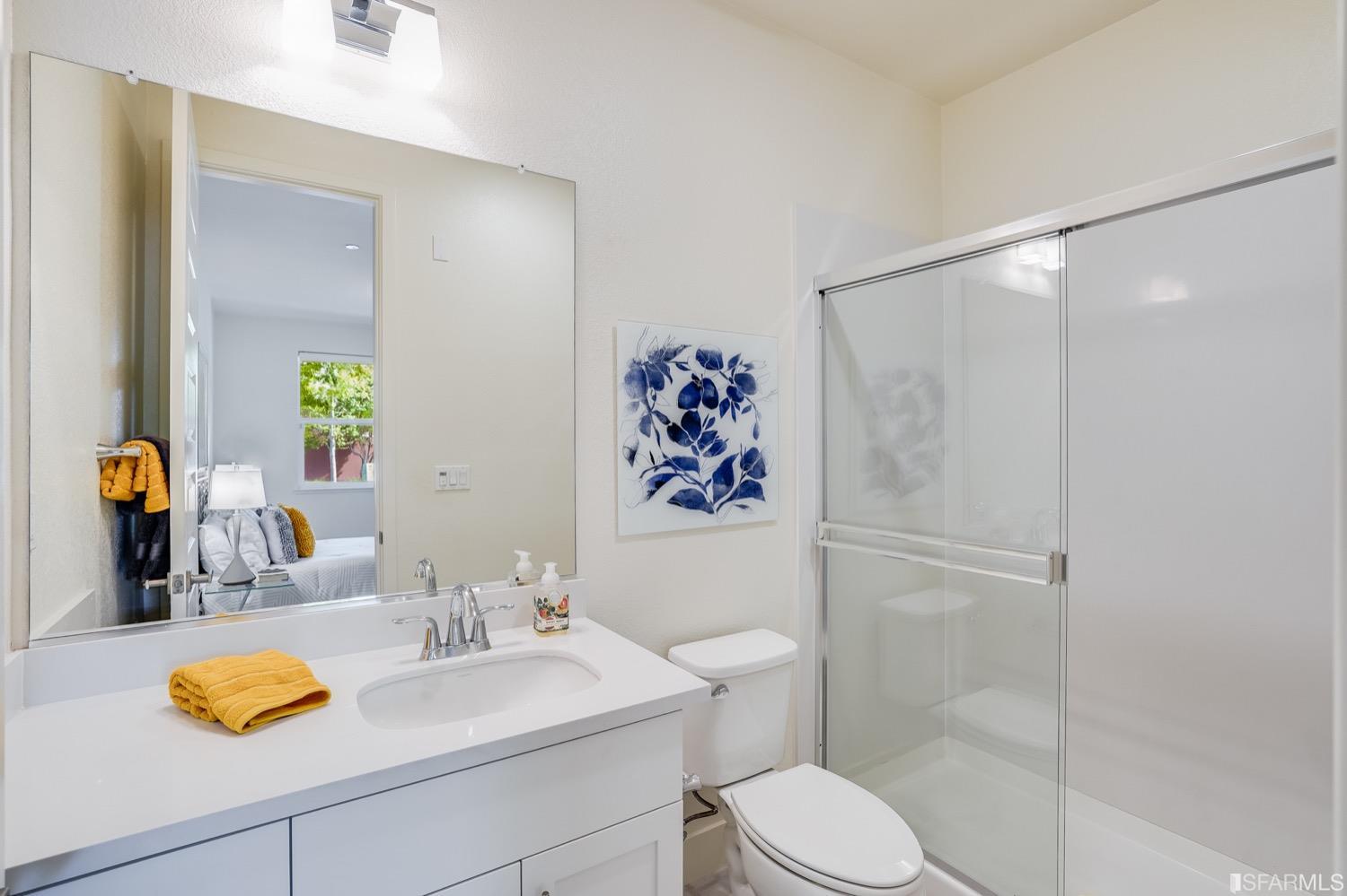 471 Mitchell Avenue Alameda, CA 94501 - Photo 9 of 50 a bathroom with a toilet sink and mirror