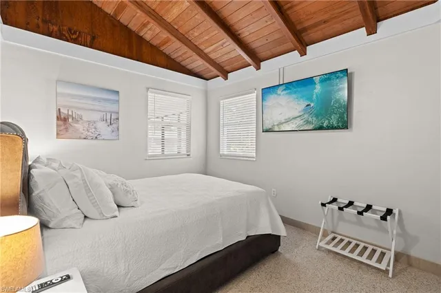 a kitchen with sink a window and couch
