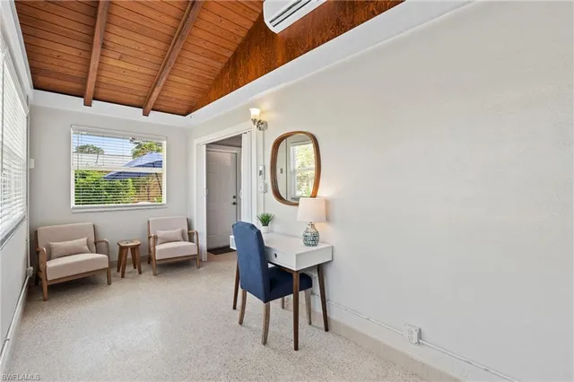 a view of a dining room with furniture window and outside view